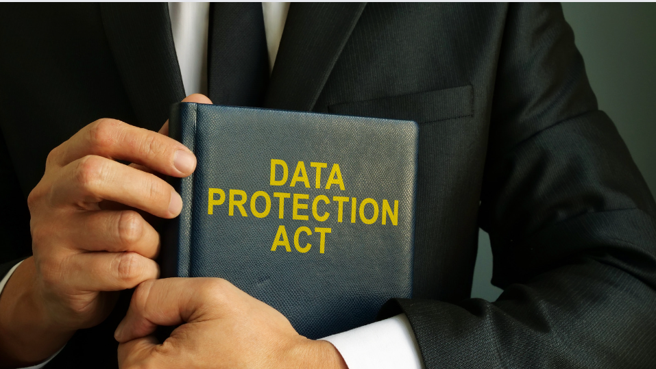 lawyer-holding-a-book-titled-data-protection-act